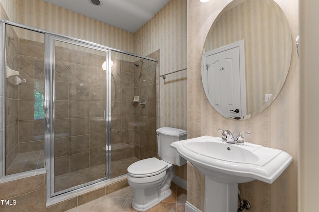 7212 Donneeford Rd, Wake Forest, NC 27587 - bathroom featuring tile patterned flooring, toilet, a stall shower, and wallpapered walls