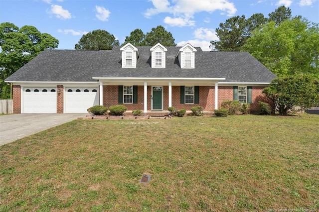 105 Little Rock Dr, Raeford, NC 28376 - new england style home with brick siding, a garage, a porch, driveway, and a front yard