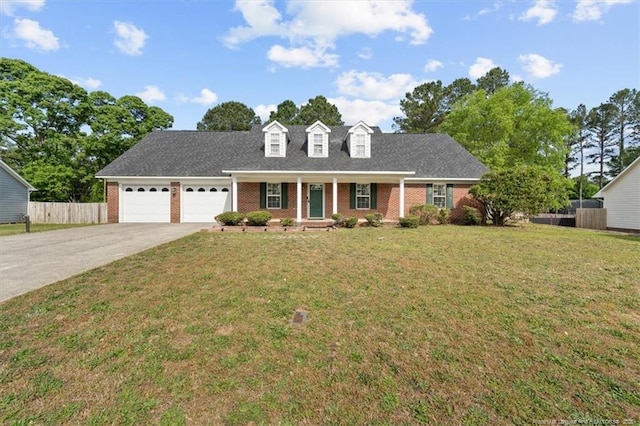 105 Little Rock Dr, Raeford, NC 28376 - cape cod house featuring brick siding, a garage, covered porch, and driveway