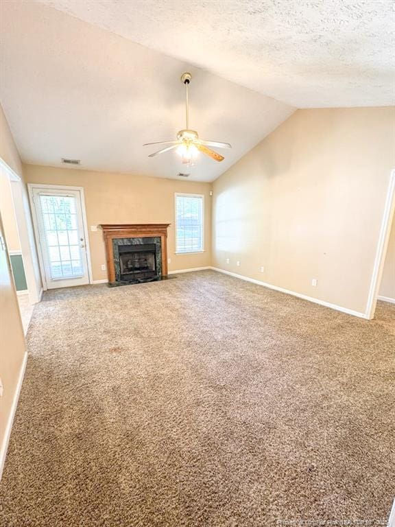 105 Little Rock Dr, Raeford, NC 28376 - unfurnished living room with a ceiling fan, vaulted ceiling, healthy amount of natural light, carpet flooring, and baseboards