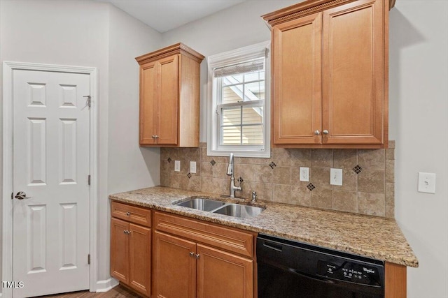 202 Verrazano Pl, Clayton, NC 27520 - kitchen with black dishwasher, a sink, backsplash, and light stone counters