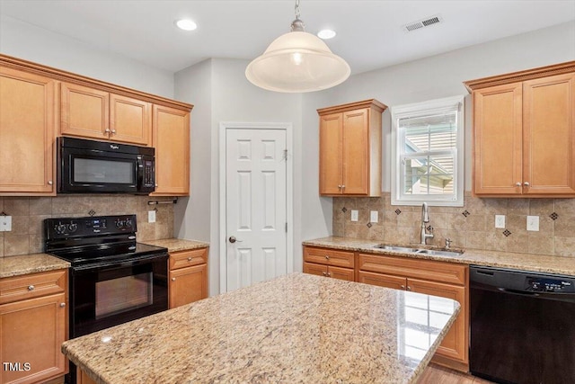 202 Verrazano Pl, Clayton, NC 27520 - kitchen with black appliances, a sink, tasteful backsplash, light stone countertops, and recessed lighting