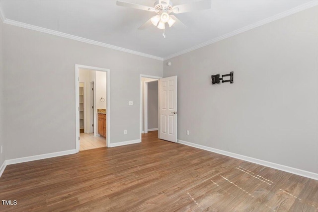 202 Verrazano Pl, Clayton, NC 27520 - unfurnished bedroom featuring light wood finished floors, crown molding, baseboards, a ceiling fan, and ensuite bath