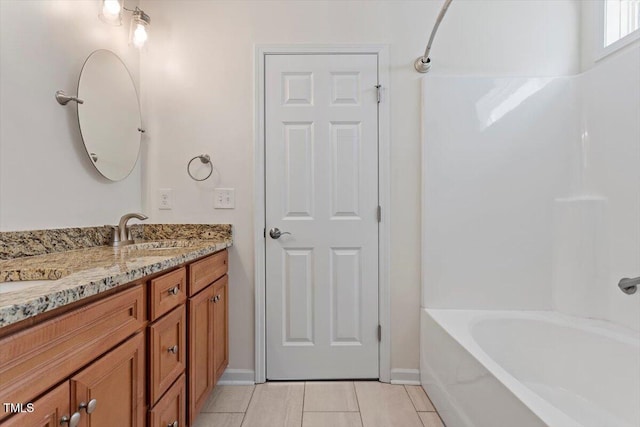 202 Verrazano Pl, Clayton, NC 27520 - full bath featuring vanity, tile patterned floors,  shower combination, and baseboards