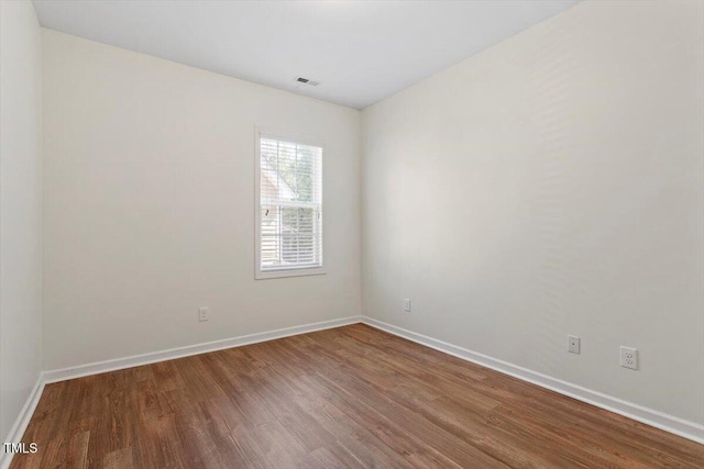 202 Verrazano Pl, Clayton, NC 27520 - spare room with wood finished floors and baseboards