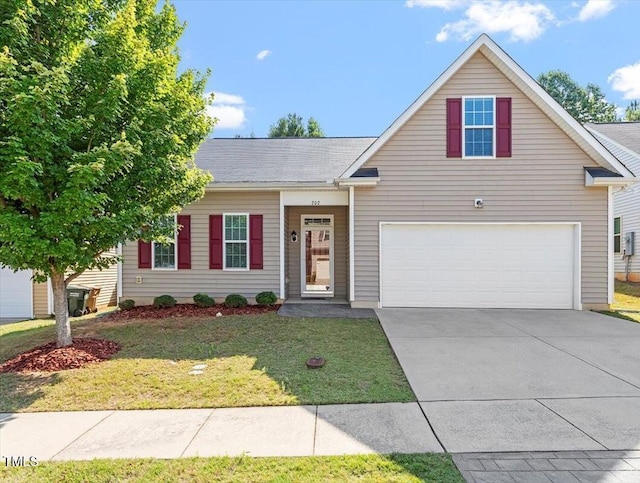 202 Verrazano Pl, Clayton, NC 27520 - traditional-style house featuring a front yard, driveway, and roof with shingles