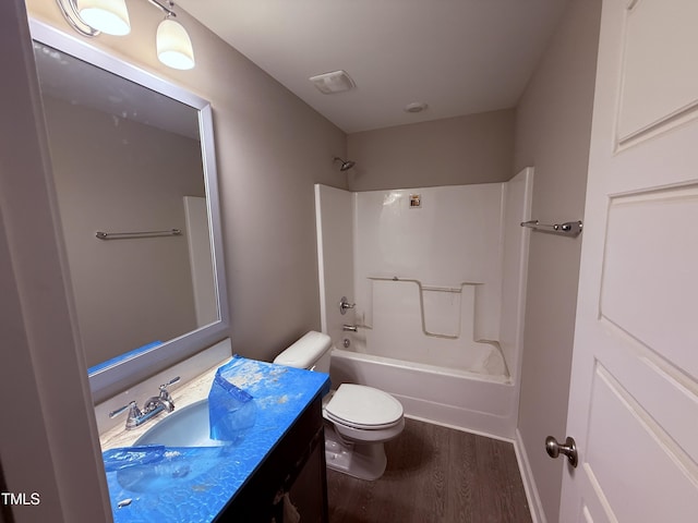 72 Ruskin Dr, Smithfield, NC 27577 - bathroom featuring wood finished floors, toilet, vanity, and shower / bath combination