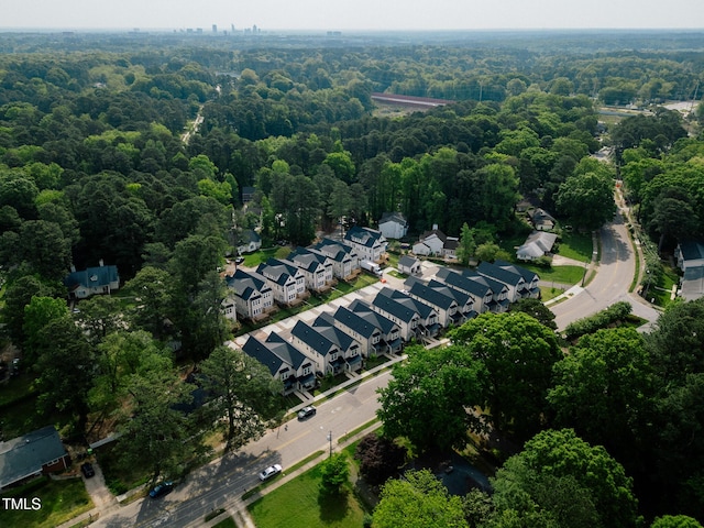 birds eye view of property with a wooded view and a residential view