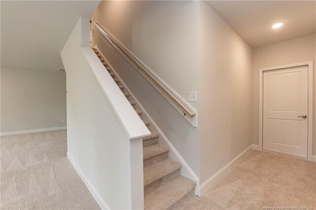 stairway with recessed lighting, carpet flooring, and baseboards