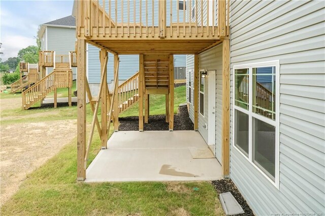 view of patio featuring stairway and a wooden deck