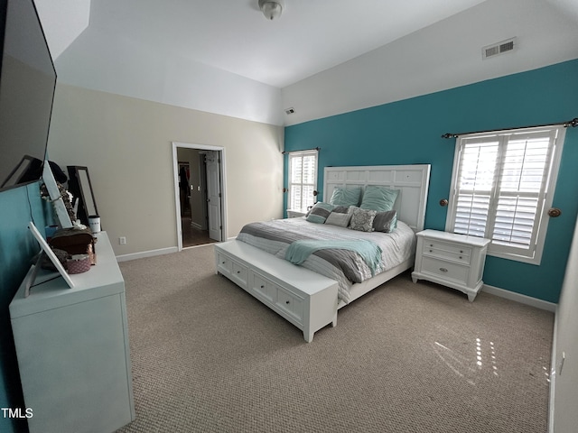 bedroom featuring vaulted ceiling, carpet, and baseboards