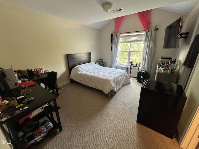 bedroom featuring vaulted ceiling, carpet, and baseboards