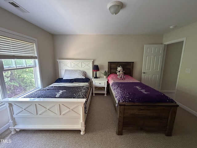 bedroom featuring carpet flooring and baseboards