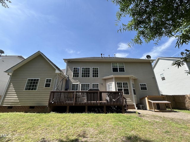 back of property featuring crawl space and a wooden deck