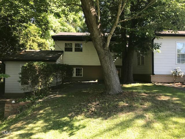 5002 Wickham Rd, Raleigh, NC 27606 - back of house featuring a lawn
