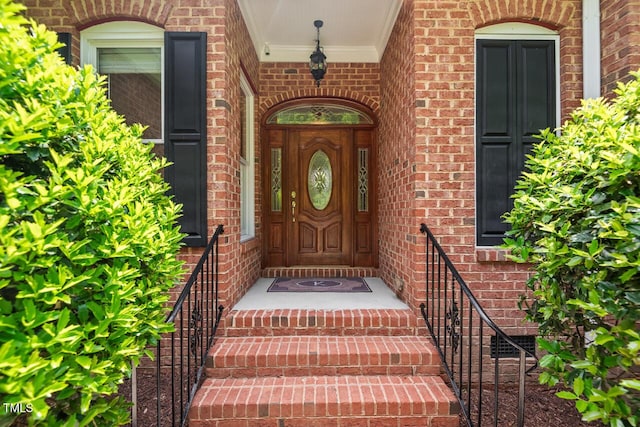 property entrance with brick siding