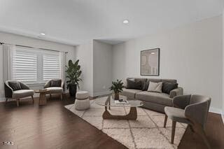 living area featuring wood finished floors and baseboards