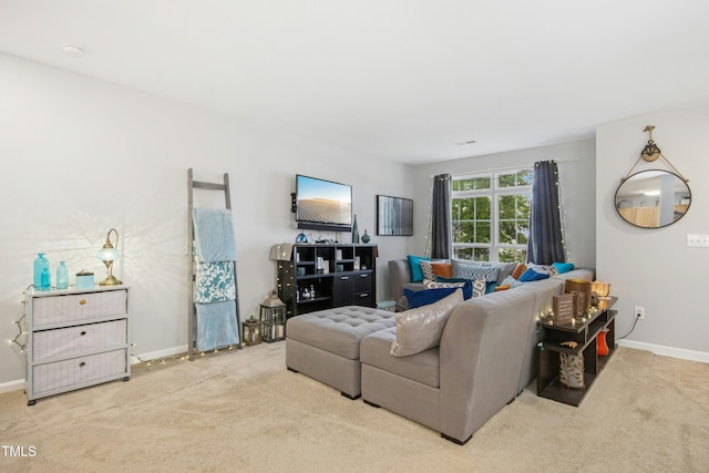 carpeted living room featuring baseboards