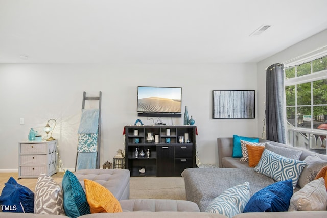 living room featuring visible vents