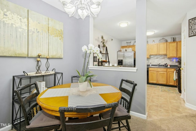 dining room with an inviting chandelier and baseboards