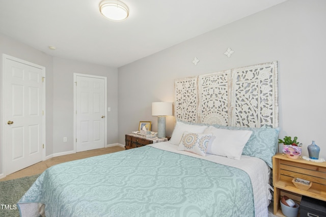 carpeted bedroom with baseboards