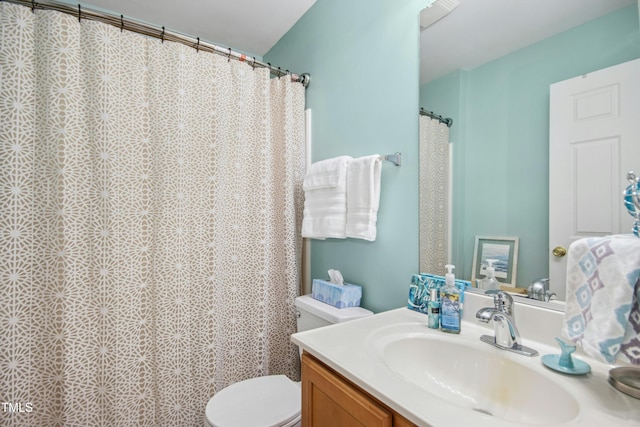 full bathroom featuring vanity and toilet