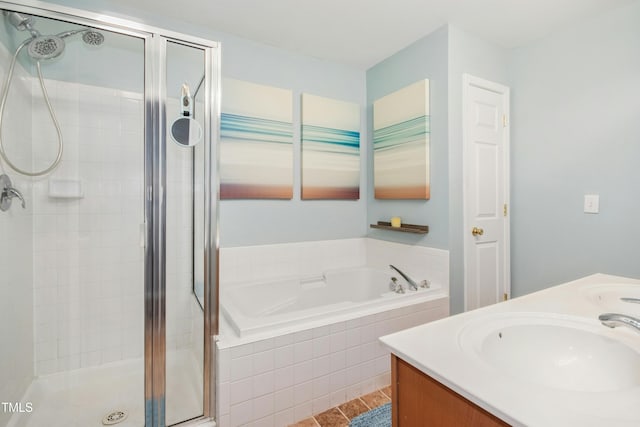 full bathroom with a sink, double vanity, a stall shower, and a bath