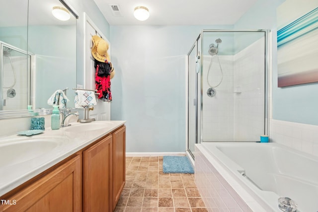 full bath featuring a garden tub, double vanity, visible vents, a shower stall, and a sink