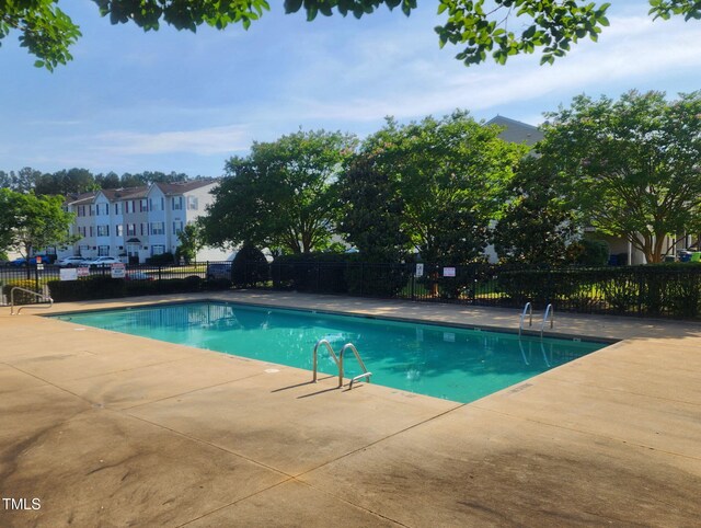 8640 Neuse Landing Ln Unit 110, Raleigh, NC 27616 - community pool with a patio area