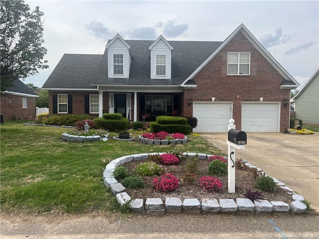 3418 Rudland Ct, Fayetteville, NC 28304 - view of front facade featuring brick siding, a front yard, driveway, and an attached garage