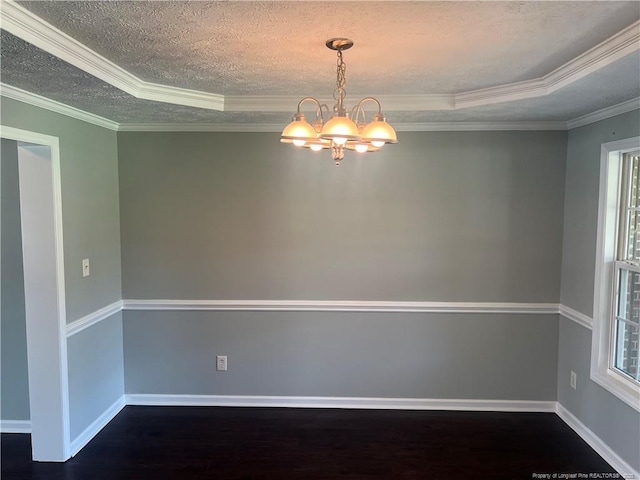 3418 Rudland Ct, Fayetteville, NC 28304 - spare room with a chandelier, dark wood finished floors, plenty of natural light, crown molding, and a textured ceiling