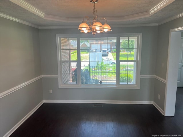 3418 Rudland Ct, Fayetteville, NC 28304 - unfurnished dining area with plenty of natural light, dark wood-style floors, a chandelier, a raised ceiling, and crown molding