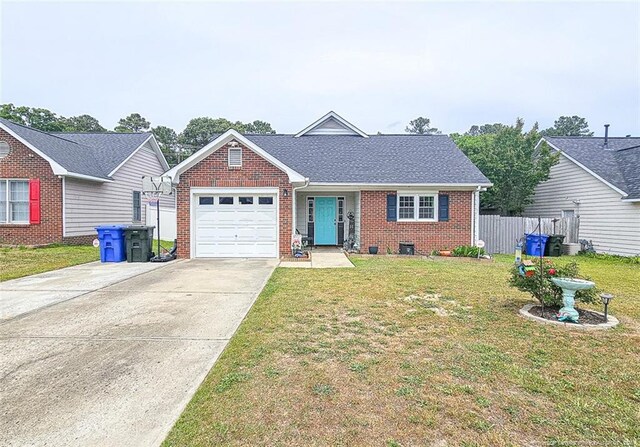 6314 Greycliff Dr, Fayetteville, NC 28314 - view of front of house featuring a garage, brick siding, and driveway