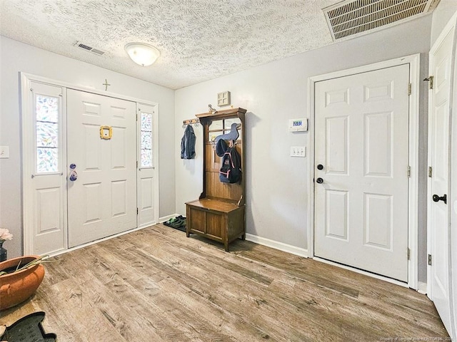 6314 Greycliff Dr, Fayetteville, NC 28314 - foyer with wood finished floors, a textured ceiling, and baseboards