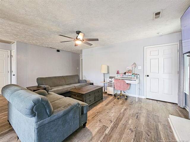 6314 Greycliff Dr, Fayetteville, NC 28314 - living area with wood finished floors, ceiling fan, a textured ceiling, and an office area