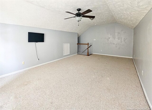 6314 Greycliff Dr, Fayetteville, NC 28314 - bonus room featuring a textured ceiling, vaulted ceiling, carpet flooring, ceiling fan, and baseboards
