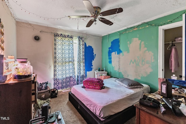 bedroom featuring a textured ceiling, carpet, and ceiling fan