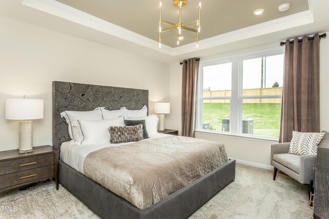 1606 Garden Park Cir, Fuquay Varina, NC 27526 - bedroom featuring light colored carpet, ornamental molding, a tray ceiling, and multiple windows