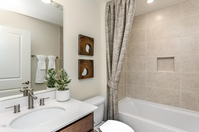 1606 Garden Park Cir, Fuquay Varina, NC 27526 - bathroom with vanity, toilet, and shower / tub combo with curtain