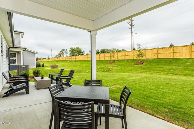 1606 Garden Park Cir, Fuquay Varina, NC 27526 - view of patio with outdoor dining area and a fenced backyard