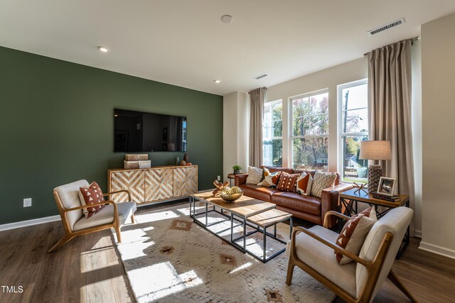 LOT5 Cooper St, Sanford, NC 27330 - living area featuring baseboards, visible vents, and wood finished floors