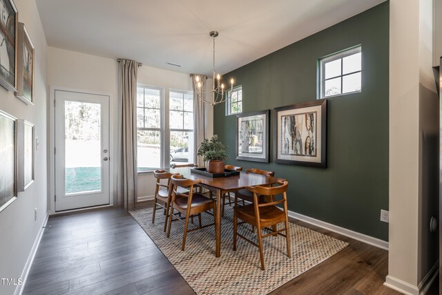 LOT5 Cooper St, Sanford, NC 27330 - dining space featuring dark wood finished floors, baseboards, an inviting chandelier, and a healthy amount of sunlight