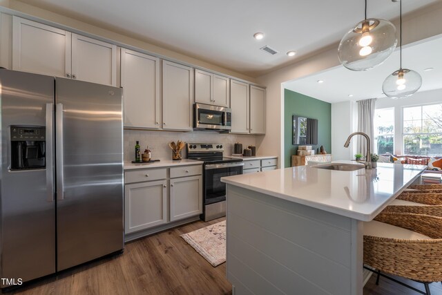 LOT5 Cooper St, Sanford, NC 27330 - kitchen with visible vents, gray cabinets, stainless steel appliances, and a sink