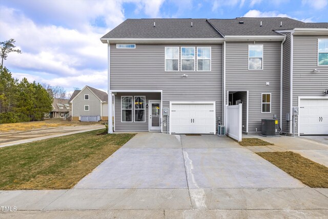 LOT5 Cooper St, Sanford, NC 27330 - view of front of property with driveway, central AC unit, a front yard, and a garage