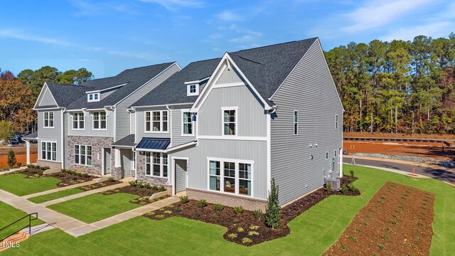 LOT5 Cooper St, Sanford, NC 27330 - traditional home featuring a front yard, stone siding, a shingled roof, and central AC