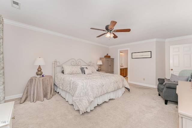 bedroom with crown molding, light colored carpet, baseboards, ceiling fan, and connected bathroom