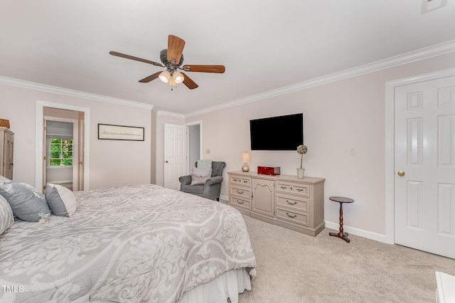 carpeted bedroom with ornamental molding, baseboards, and a ceiling fan