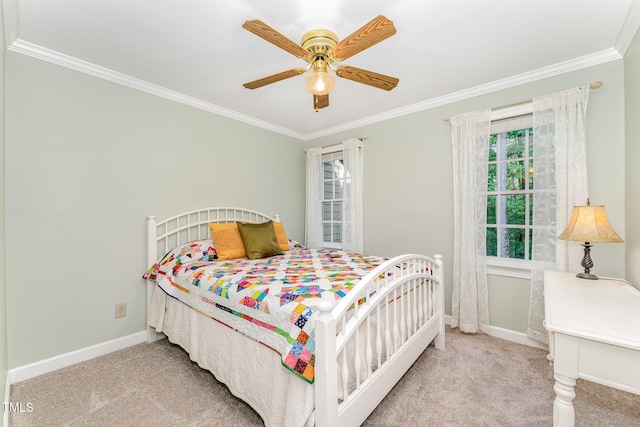 bedroom featuring ornamental molding, carpet flooring, baseboards, and ceiling fan