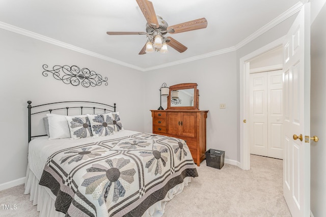 carpeted bedroom featuring crown molding, baseboards, and ceiling fan