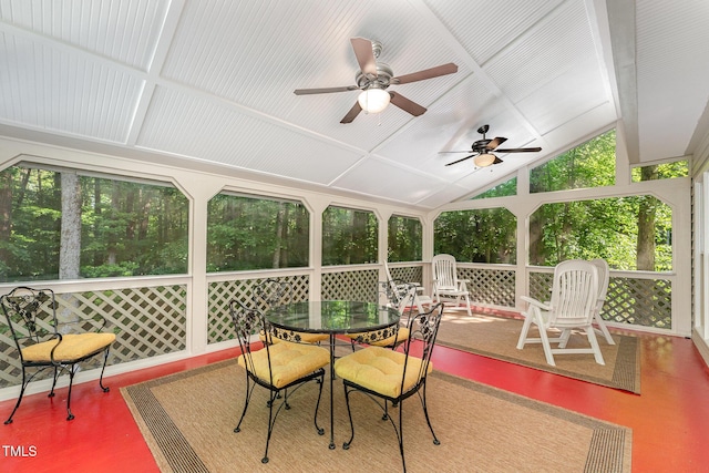 sunroom / solarium with a ceiling fan, vaulted ceiling, and outdoor dining area